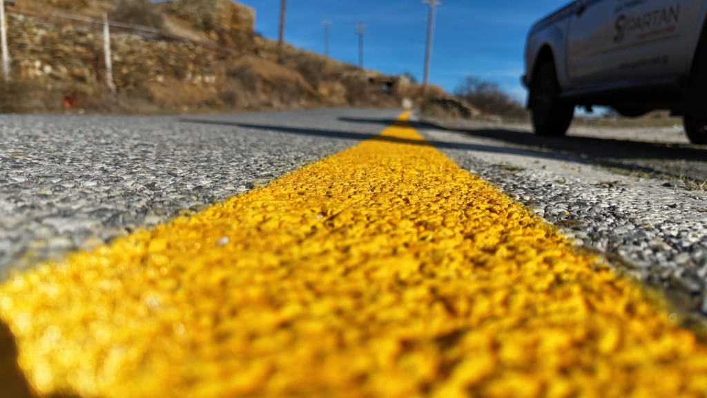 Fresh yellow centre line marking on a provincial road